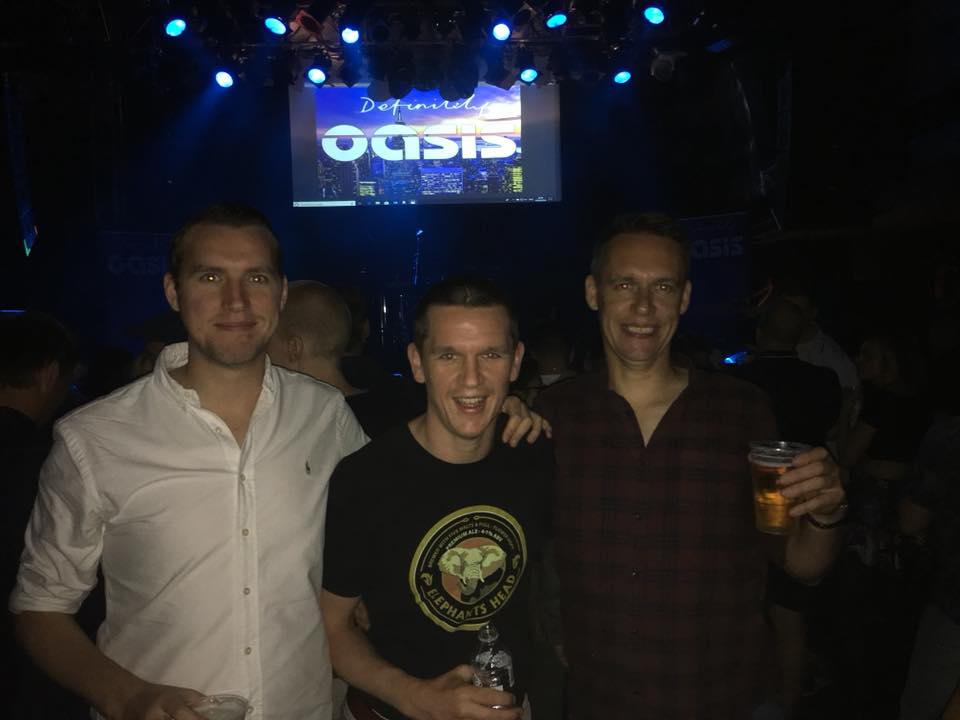 Photo of Ryan and two brother at Oasis gig